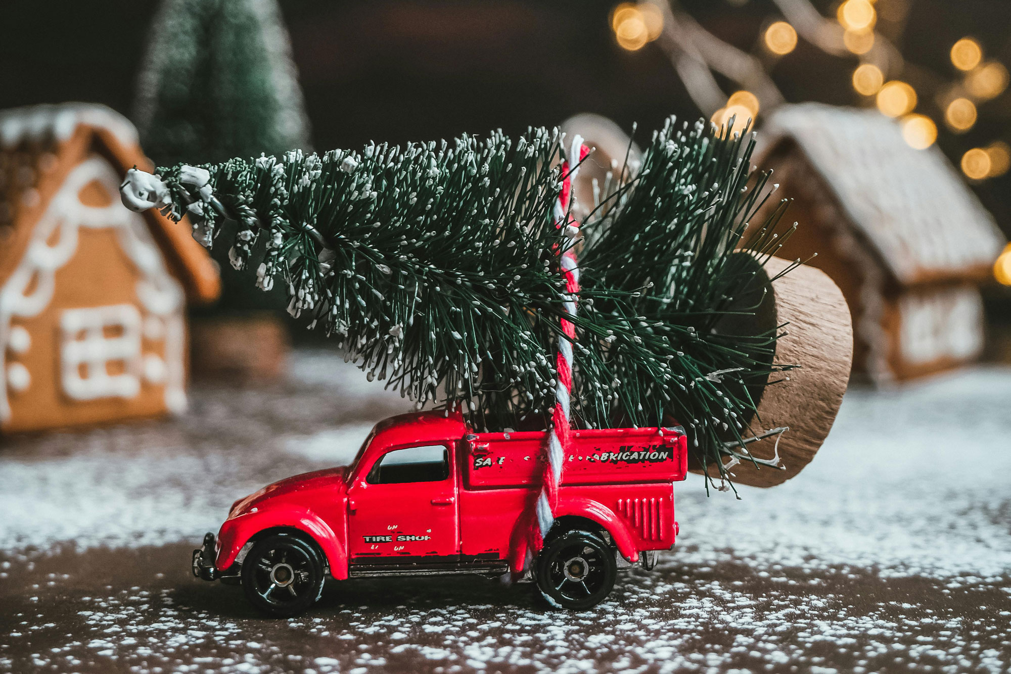 holiday decorations, red cast iron truck with carrying a artificial tree